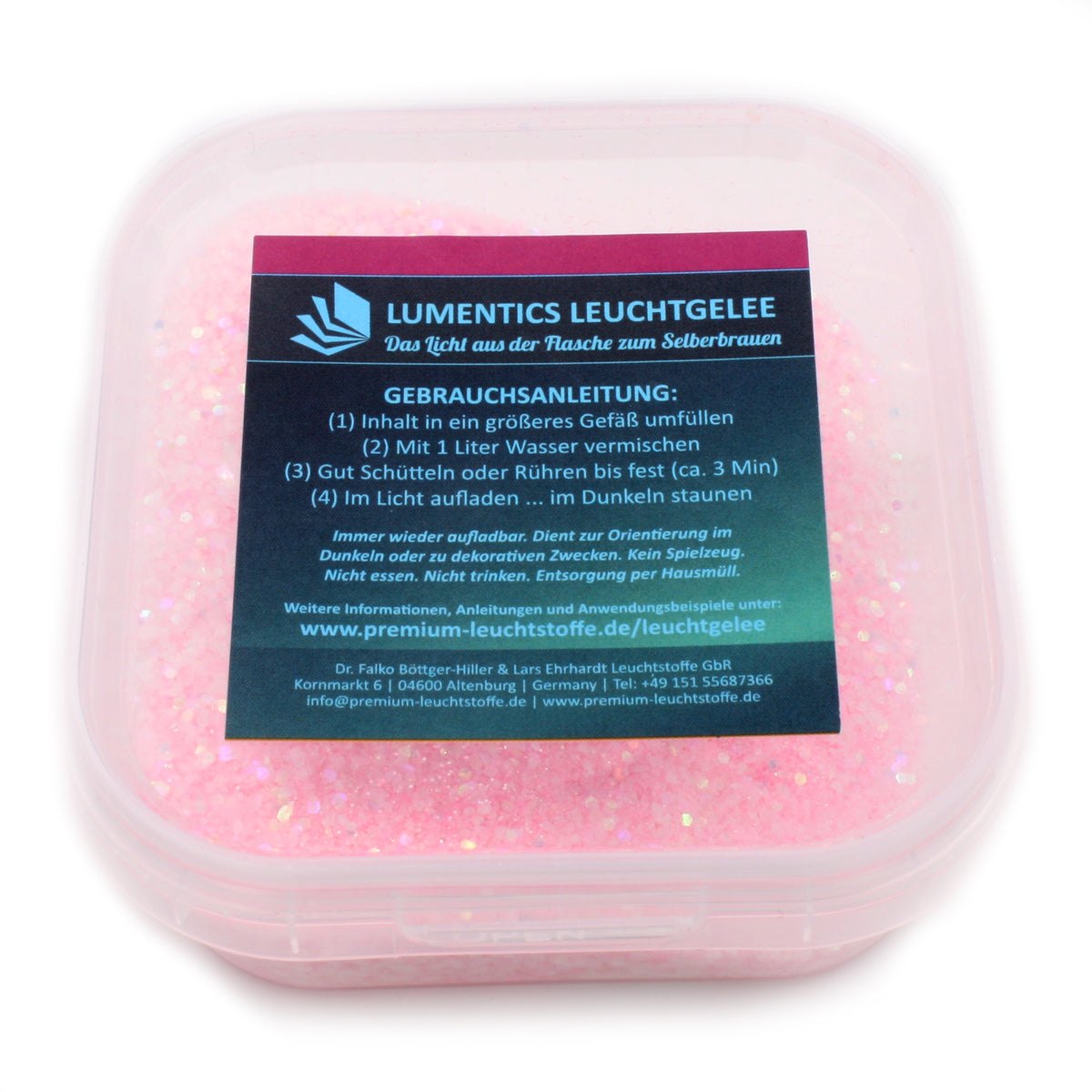 Leucht-Gelee mit Glitzer Rosa/Gelbgrün 45 g: Dose mit rosa Glitzerpulver und Gebrauchsanleitung bei Tageslicht
